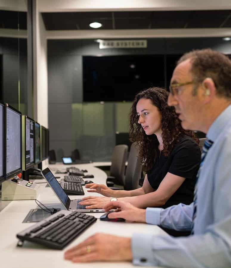 Two people working at computers